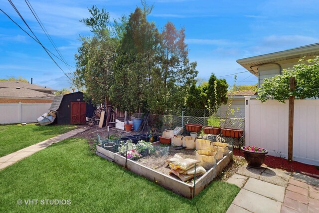 9125 W 144th Pl, Orland Park, IL 60462 - view of yard with a vegetable garden, a storage shed, and an outdoor structure