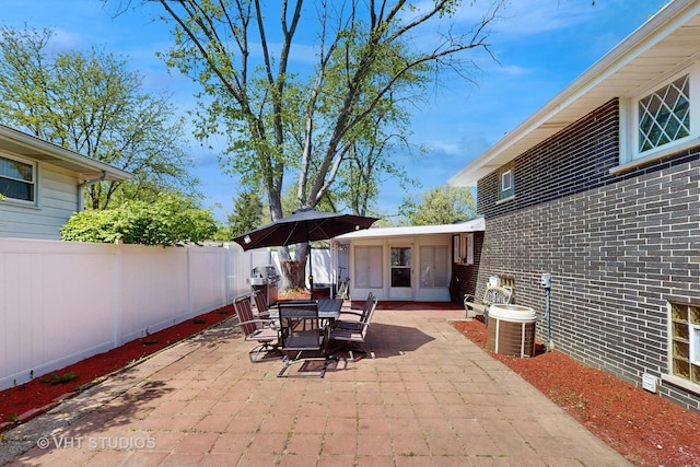 9125 W 144th Pl, Orland Park, IL 60462 - view of patio with a fenced backyard, central air condition unit, and outdoor dining space