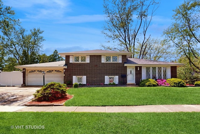 9125 W 144th Pl, Orland Park, IL 60462 - split level home with a garage, brick siding, and concrete driveway