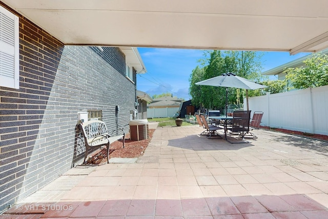 9125 W 144th Pl, Orland Park, IL 60462 - view of patio / terrace featuring a fenced backyard, outdoor dining area, and central air condition unit