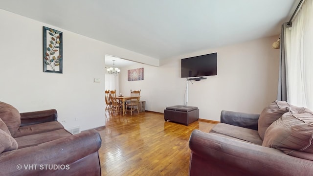 9125 W 144th Pl, Orland Park, IL 60462 - living area featuring a chandelier, light wood-type flooring, and baseboards