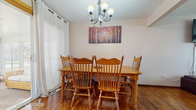 9125 W 144th Pl, Orland Park, IL 60462 - dining room featuring a chandelier, wood finished floors, and baseboards