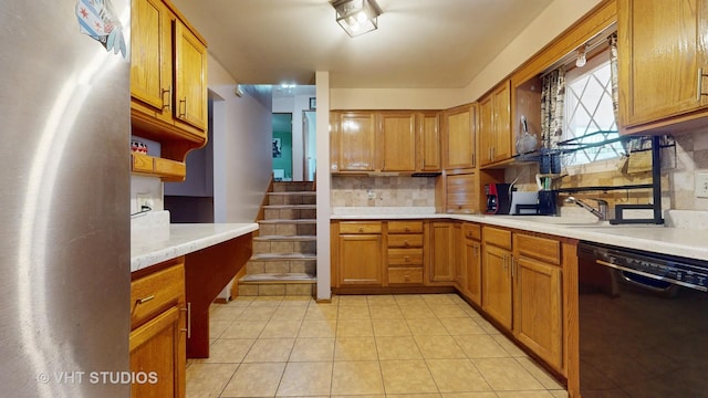 9125 W 144th Pl, Orland Park, IL 60462 - kitchen featuring dishwasher, freestanding refrigerator, light countertops, tasteful backsplash, and brown cabinets