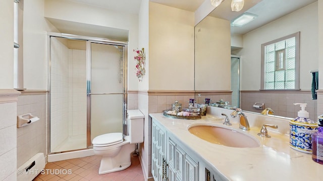270 Concord Dr, Melrose Park, IL 60160 - bathroom with tile walls, a baseboard heating unit, tile patterned flooring, a stall shower, and vanity