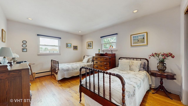 270 Concord Dr, Melrose Park, IL 60160 - bedroom with baseboard heating, light wood-style flooring, and recessed lighting
