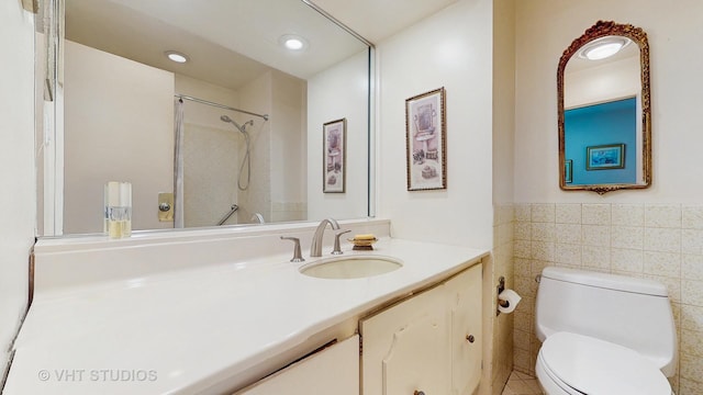 270 Concord Dr, Melrose Park, IL 60160 - full bathroom with vanity, a shower, tile walls, a wainscoted wall, and recessed lighting