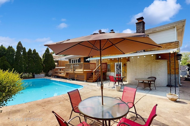 270 Concord Dr, Melrose Park, IL 60160 - view of swimming pool with a deck, a patio, stairway, and outdoor dining area