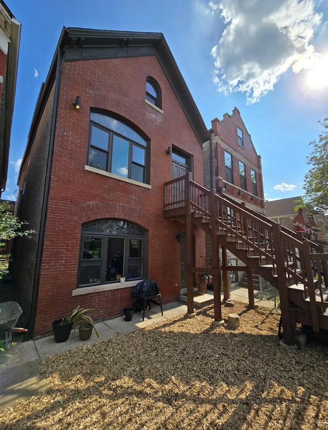 2625 W Cullerton St, Chicago, IL 60608 - back of house featuring brick siding and stairs