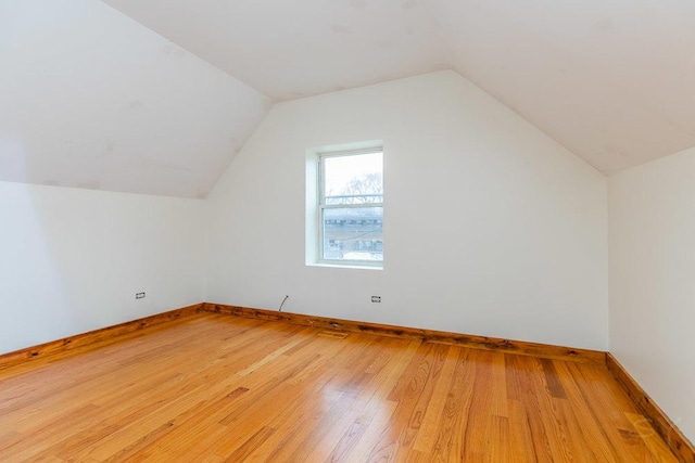 2625 W Cullerton St, Chicago, IL 60608 - additional living space featuring vaulted ceiling, baseboards, and wood finished floors