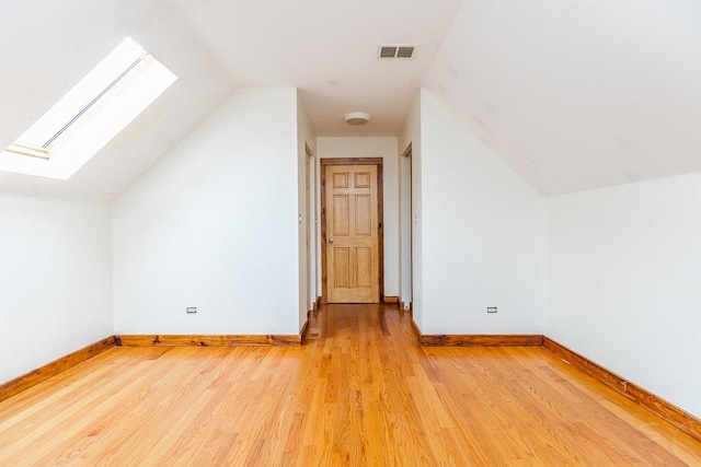 2625 W Cullerton St, Chicago, IL 60608 - additional living space featuring lofted ceiling with skylight, visible vents, baseboards, and light wood-type flooring