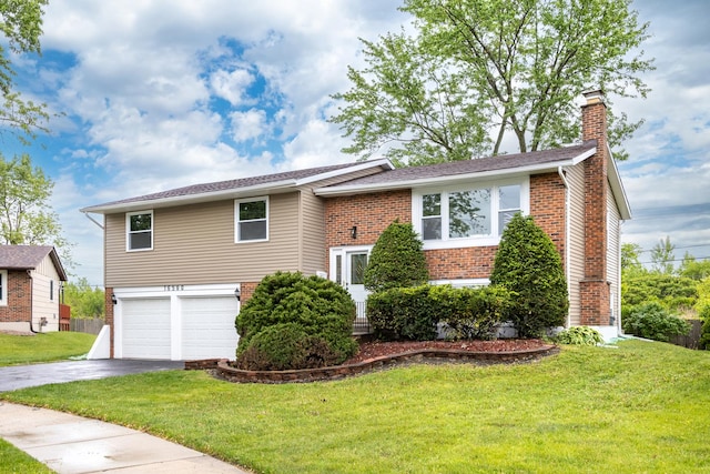 16560 Woodlawn W Ave, South Holland, IL 60473 - view of front of property featuring a chimney, brick siding, a garage, driveway, and a front lawn