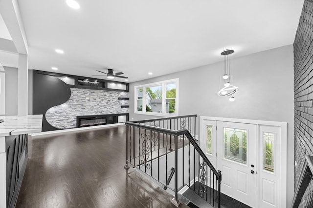 16560 Woodlawn W Ave, South Holland, IL 60473 - foyer entrance featuring a glass covered fireplace, a ceiling fan, wood finished floors, and recessed lighting