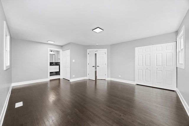 16560 Woodlawn W Ave, South Holland, IL 60473 - unfurnished living room featuring dark wood finished floors and baseboards