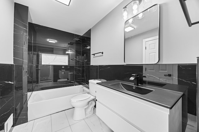 16560 Woodlawn W Ave, South Holland, IL 60473 - bathroom featuring tile walls, shower / tub combination, vanity, toilet, and a wainscoted wall