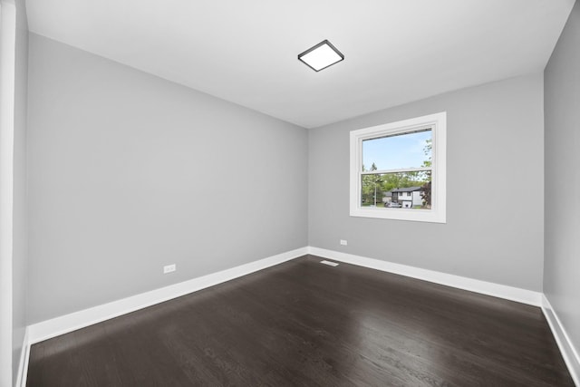 16560 Woodlawn W Ave, South Holland, IL 60473 - empty room featuring baseboards and dark wood finished floors