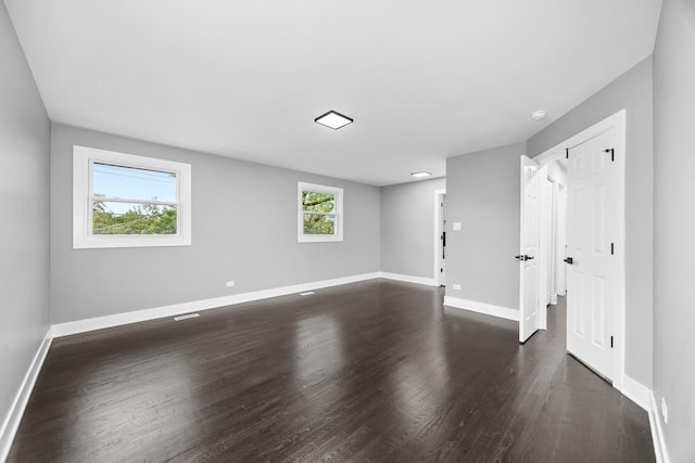16560 Woodlawn W Ave, South Holland, IL 60473 - unfurnished room with dark wood-type flooring, baseboards, and a smoke detector