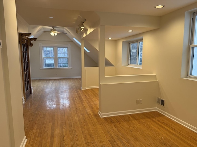 2446 W Thomas St, Chicago, IL 60622 - additional living space with baseboards, recessed lighting, visible vents, ceiling fan, and wood finished floors