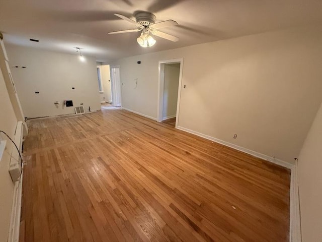 2446 W Thomas St, Chicago, IL 60622 - spare room with light wood-style floors, baseboards, and ceiling fan