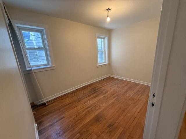 2446 W Thomas St, Chicago, IL 60622 - spare room featuring a wealth of natural light, baseboards, and wood finished floors