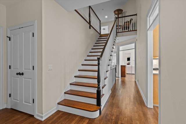 572 Vine Ave, Highland Park, IL 60035 - stairs featuring recessed lighting, wood finished floors, and baseboards