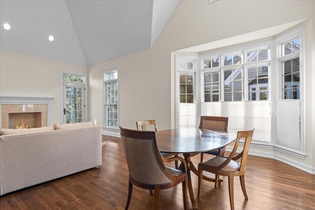 572 Vine Ave, Highland Park, IL 60035 - dining room featuring high vaulted ceiling, a premium fireplace, baseboards, dark wood-style flooring, and recessed lighting