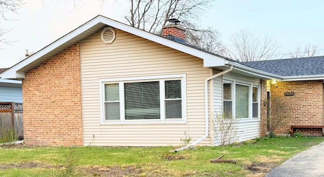 9633 Karlov Ave, Skokie, IL 60076 - view of side of home with a chimney, brick siding, and a shingled roof