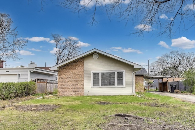 9633 Karlov Ave, Skokie, IL 60076 - view of home's exterior with brick siding, an attached carport, and driveway