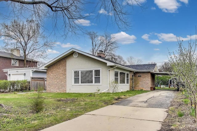 9633 Karlov Ave, Skokie, IL 60076 - view of front of property with brick siding, concrete driveway, and a chimney