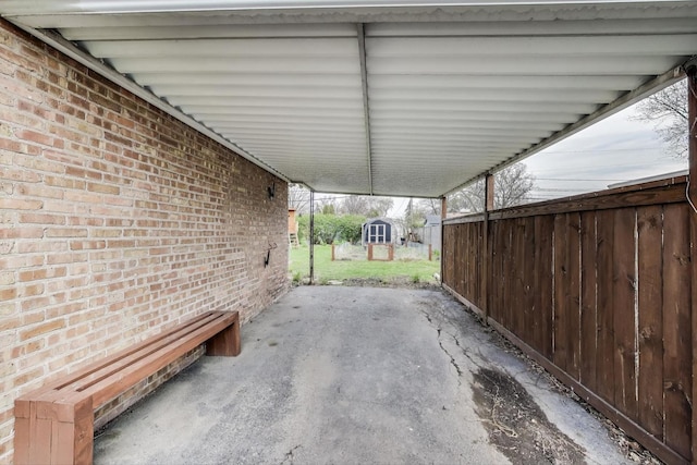 9633 Karlov Ave, Skokie, IL 60076 - view of patio with a storage unit and a carport
