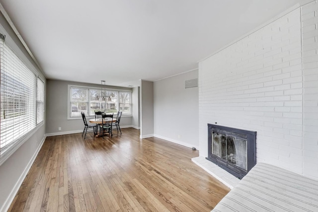 9633 Karlov Ave, Skokie, IL 60076 - living room with hardwood / wood-style flooring and a fireplace