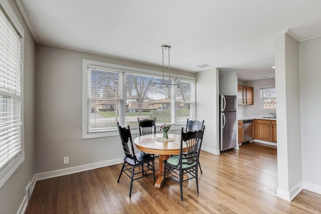 9633 Karlov Ave, Skokie, IL 60076 - dining space with light wood finished floors and baseboards