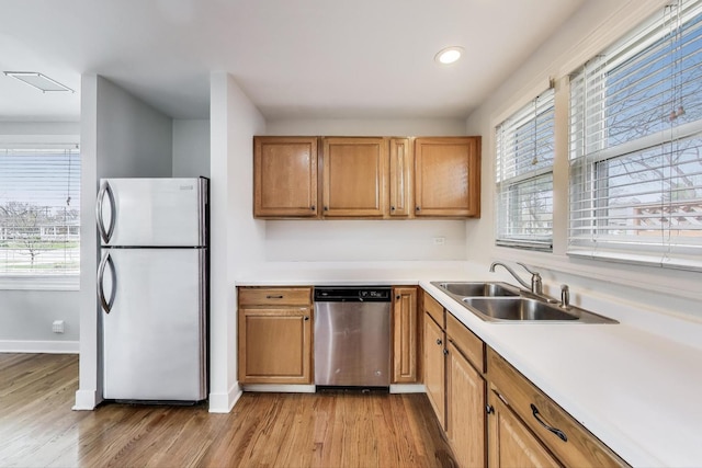9633 Karlov Ave, Skokie, IL 60076 - kitchen with appliances with stainless steel finishes, light wood-style flooring, recessed lighting, light countertops, and brown cabinets