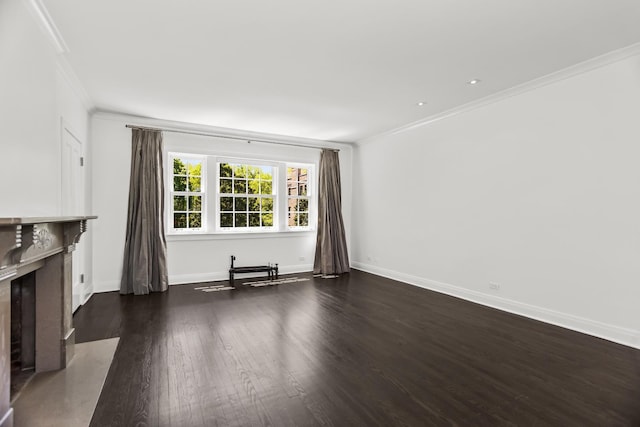 unfurnished living room featuring crown molding, dark wood finished floors, baseboards, and a premium fireplace