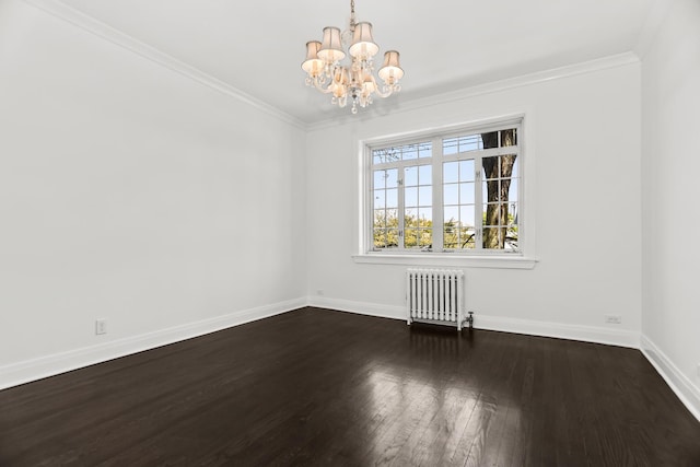 spare room featuring radiator, a chandelier, dark wood-style floors, baseboards, and ornamental molding