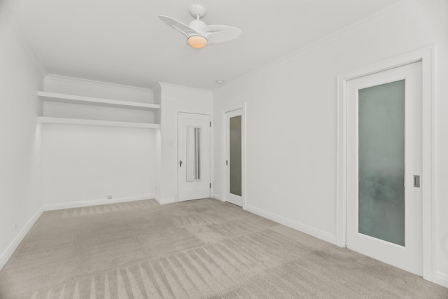 unfurnished bedroom with carpet floors, crown molding, and baseboards