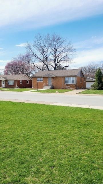 15562 Gouwens Ln, South Holland, IL 60473 - view of front of home with concrete driveway, a front lawn, and a residential view