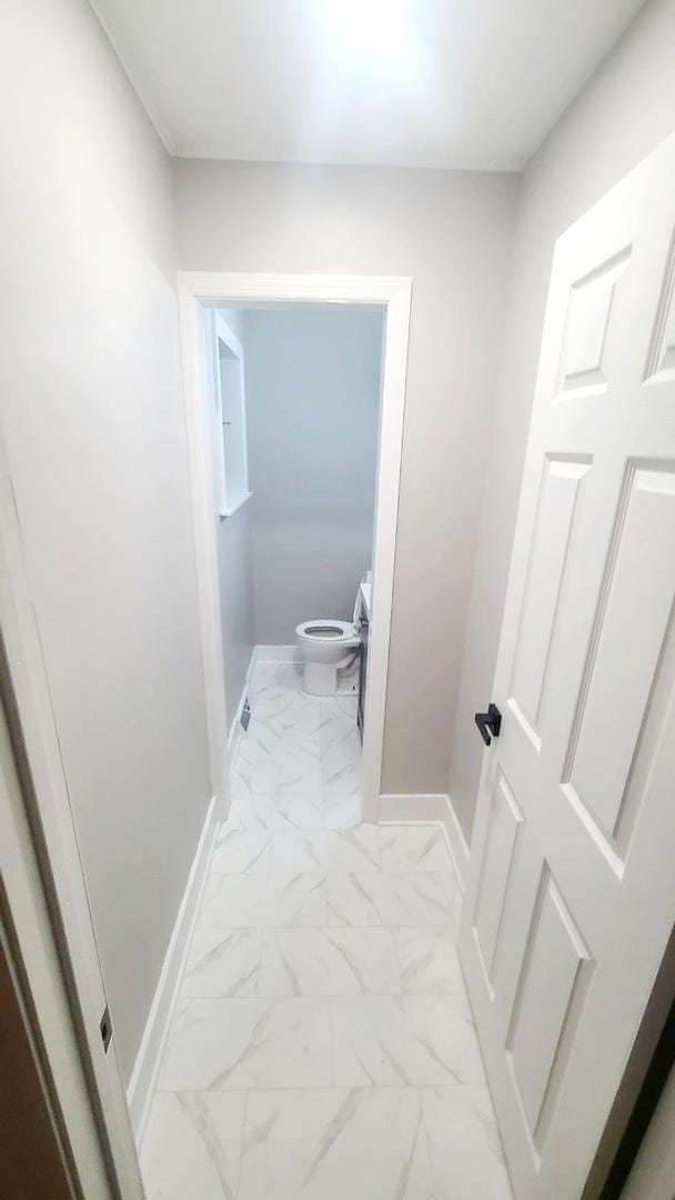 15562 Gouwens Ln, South Holland, IL 60473 - corridor featuring baseboards and marble finish floor