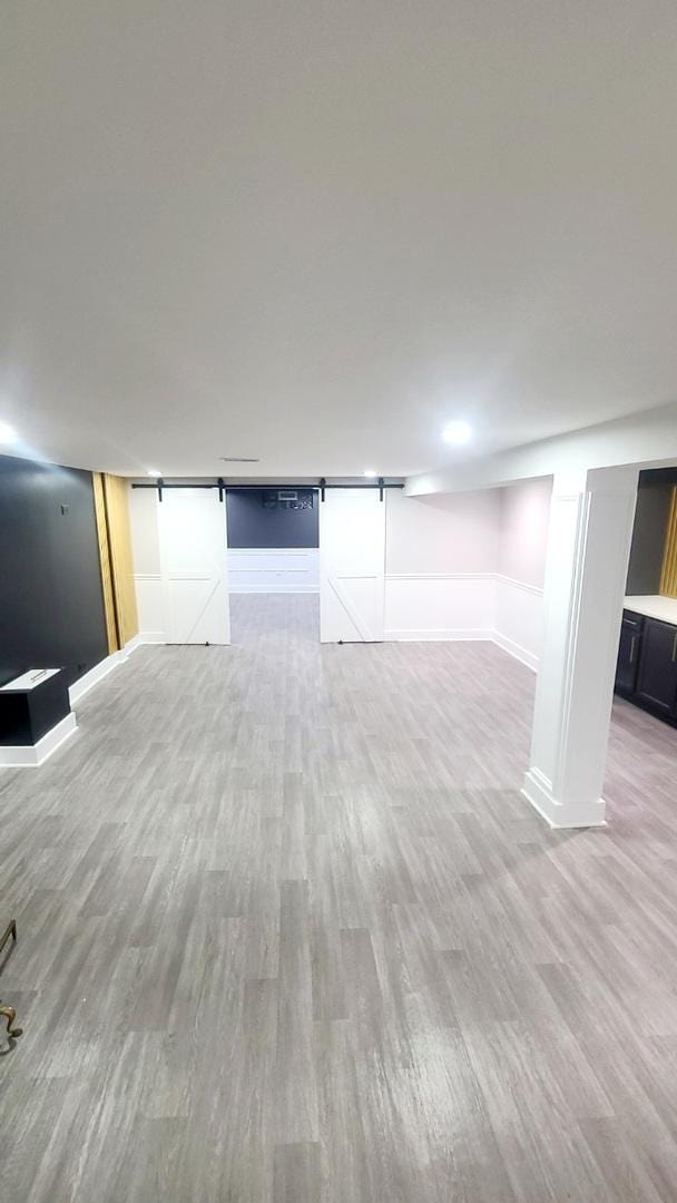 15562 Gouwens Ln, South Holland, IL 60473 - finished below grade area with light wood finished floors and baseboards