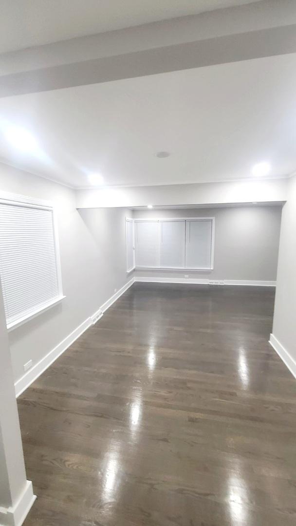 15562 Gouwens Ln, South Holland, IL 60473 - empty room with baseboards and dark wood-style floors