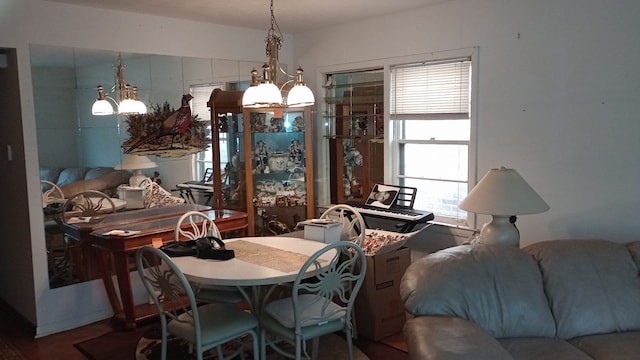 dining room with a chandelier and a healthy amount of sunlight