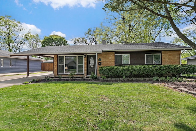 single story home with brick siding, a carport, and a chimney