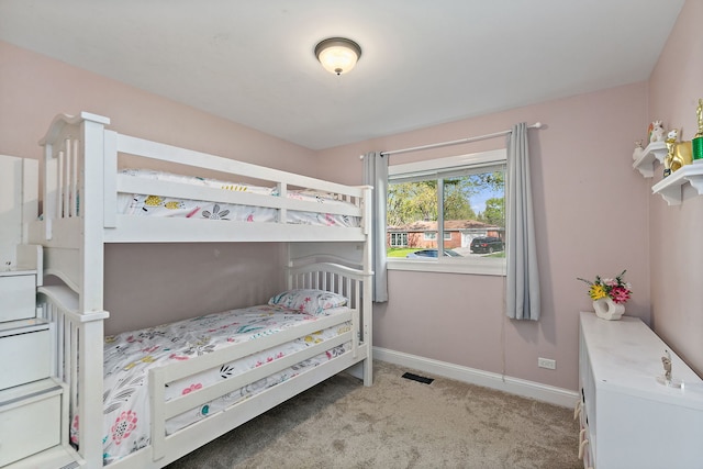 bedroom featuring carpet flooring and baseboards