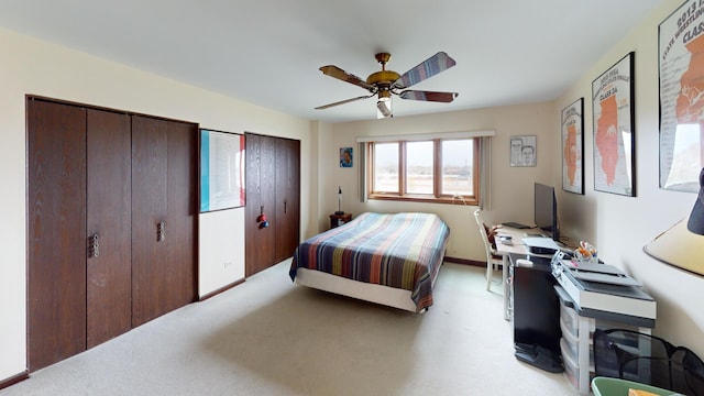 bedroom featuring ceiling fan and light carpet