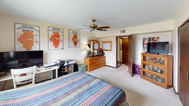 bedroom featuring visible vents, carpet flooring, and ceiling fan