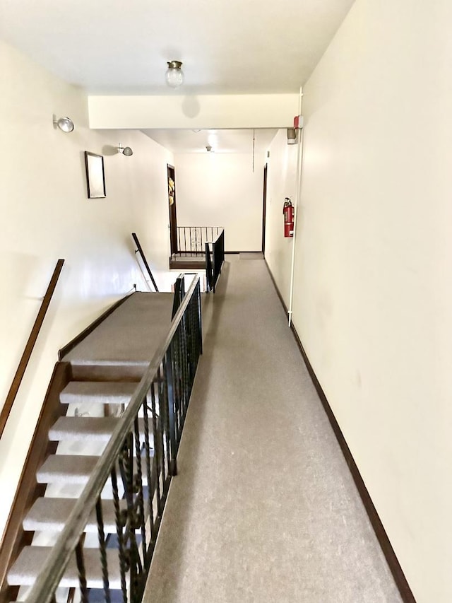 hallway featuring an upstairs landing