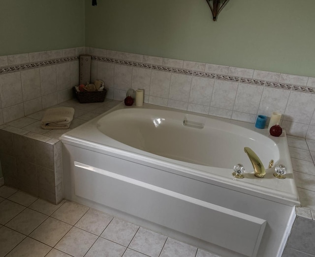 full bath with a bath and tile patterned flooring