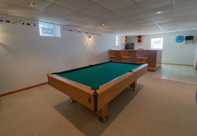 rec room featuring indoor bar, baseboards, light carpet, and recessed lighting