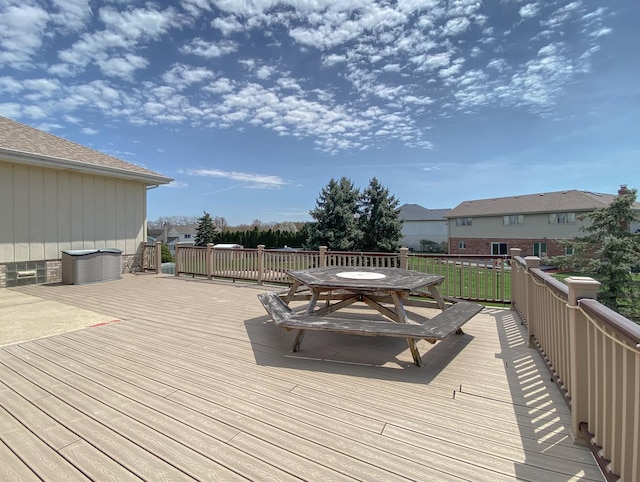 wooden terrace with outdoor dining space