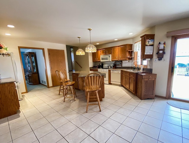 kitchen with a kitchen breakfast bar, open shelves, a sink, white appliances, and recessed lighting