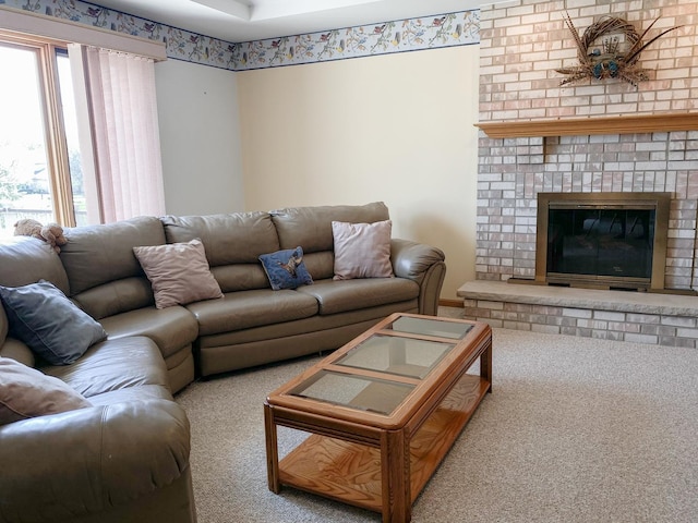 living area featuring carpet flooring and a fireplace